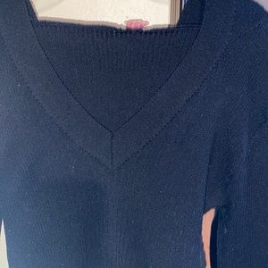 Women’s low v-neck stretchy long sleeve sweater with hoodie.